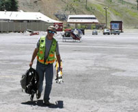 A Johnson-Frank surveyor walking towards the camera