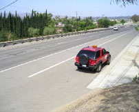 A Johnson-Frank SUV driving down the Santa Ana Canyon