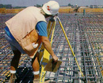 A Johnson-Frank surveyor looking through a tripod survey tool